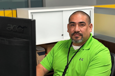 A man sitting at a computer.